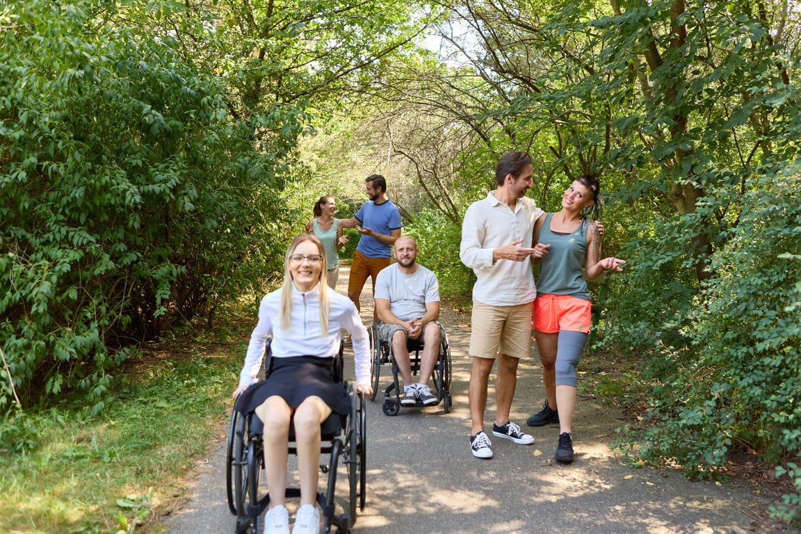 Inclusive Outdoor Adventure: Friends Enjoying a Sunny Day in the